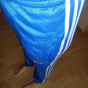 Adidas womans blue pants super close angle shot barefoot