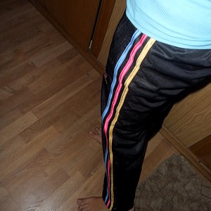 Adidas womans black pants red white and yellow stripes
