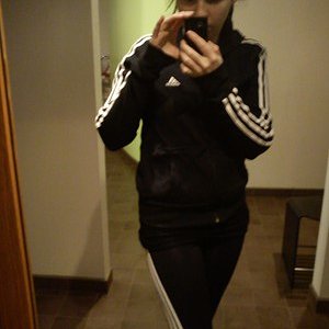 Adidas womens black and white striped track suit camera shot