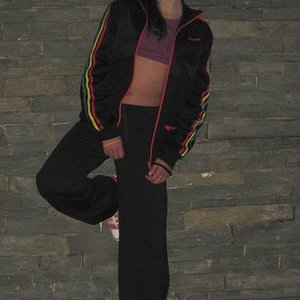 Adidas womens black suit wall lean pose