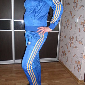 Adidas womens blue track suit side hip pose