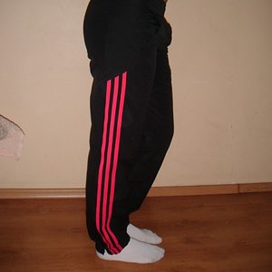 Adidas womens black pants red stripes side view