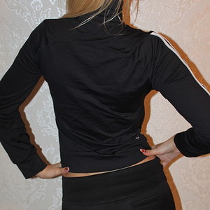 Adidas womens black top hip pose rear