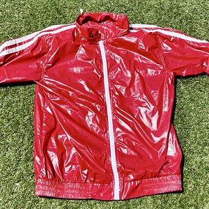 Shiny red jacket - sleeves rolled up