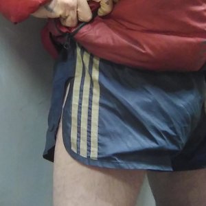 Red Puffer Jacket, vintage Adidas nylon shorts, red shiny nylon jockeys