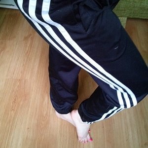 Girl with black/white adidas pants