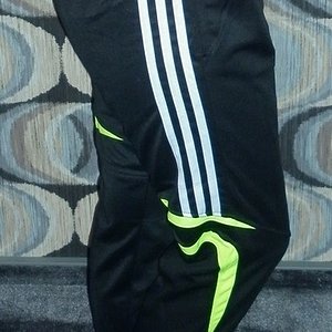 Girl with black/white adidas pants