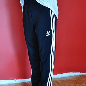 Girl with black/white adidas pants