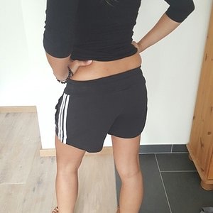 Girl in black/white Adidas shorts