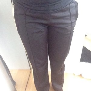 Girl in Adidas black pants