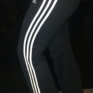 Girl in Adidas black pants