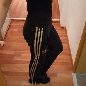 Girl in Adidas black pants