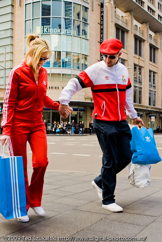 A couple in adidas track suits