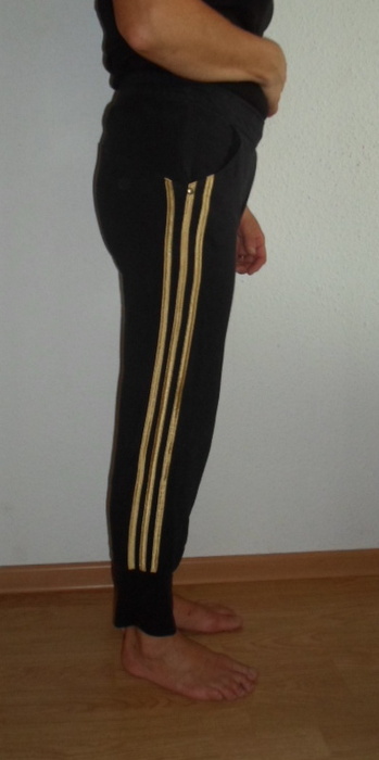 Adidas womans black pants no sleeve black top barefoot side