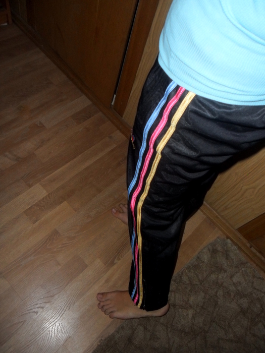 Adidas womans black pants red white and yellow stripes