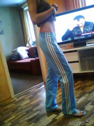 Adidas womans light blue pants barefoot other side shot