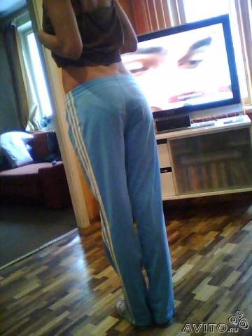 Adidas womans light blue pants barefoot rear shot