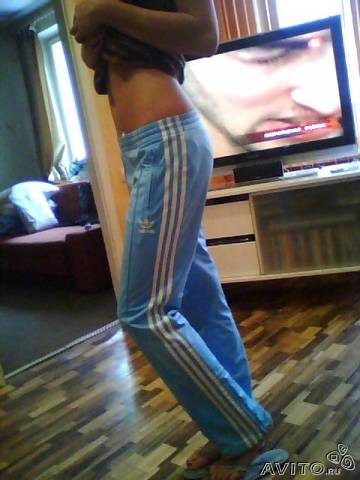 Adidas womans light blue pants barefoot side shot