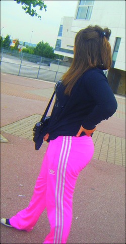 Adidas womans neon pink pants side view