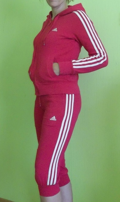 Adidas womans red track suit side pocket pose side