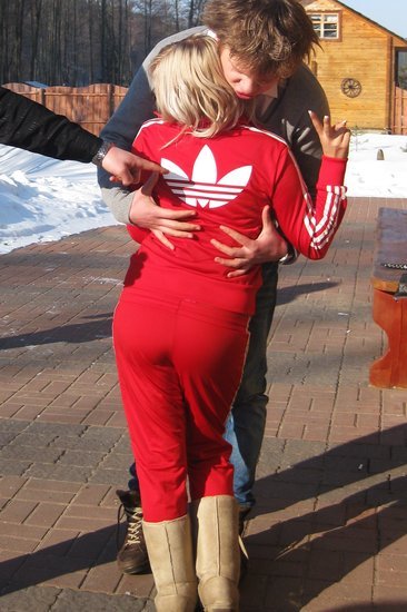 Adidas womans red track suit with white trim large back logo hug