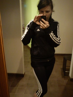 Adidas womens black and white striped track suit camera shot