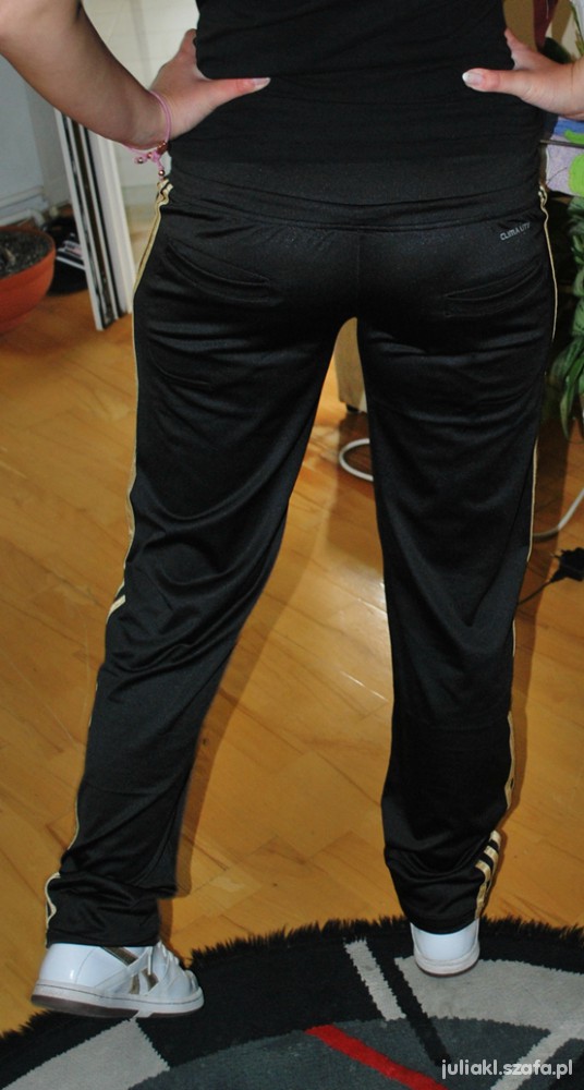 Adidas womens black pants front view wood floor