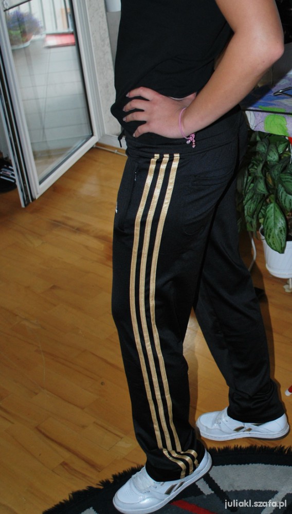 Adidas pants with hot sale gold stripes