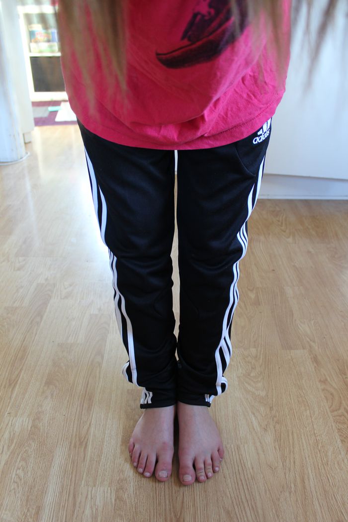 Adidas womens black pants light red top front high angle