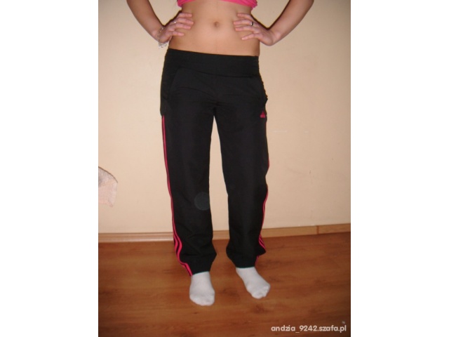 Adidas womens black pants red trim hip front pose