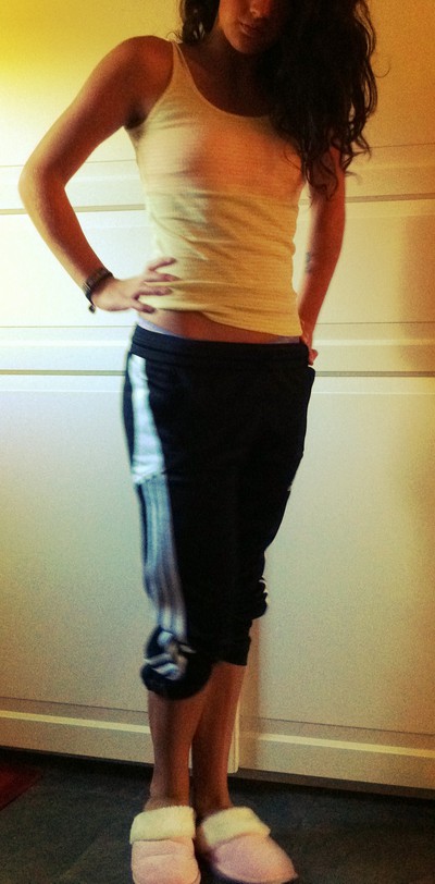 Adidas womens black pants with white stripe close hip shot