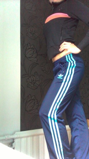 Adidas womens blue and skyblue pants knee pose