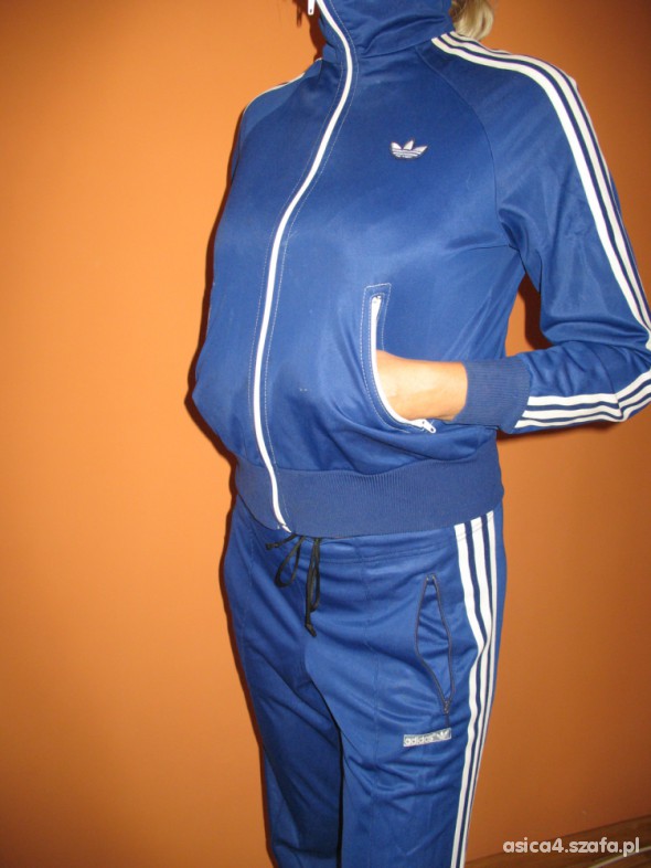 Adidas womens blue track suit pocket pose