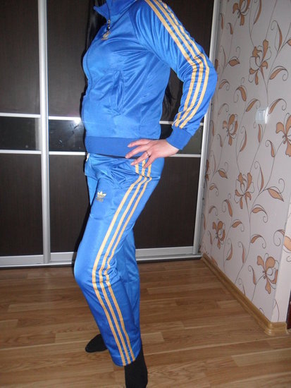 Adidas womens blue track suit side hip pose