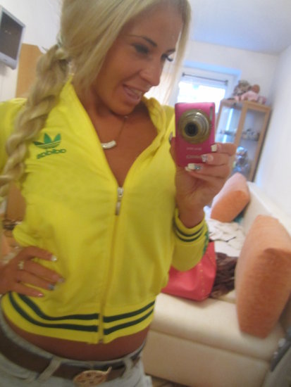 Adidas womens yellow jacket front view camera