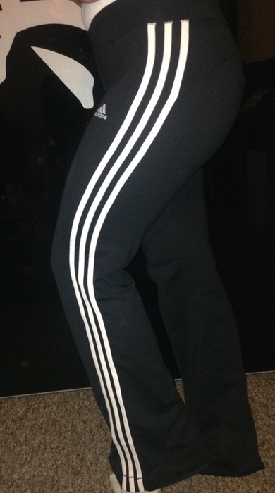 Girl in Adidas black pants