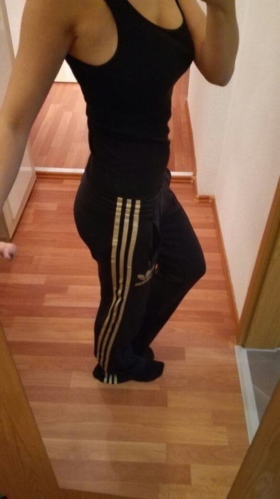 Girl in Adidas black pants