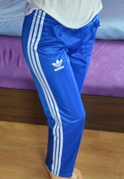 Girl in Adidas blue/white pants