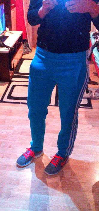 Girl in Adidas pants blue / white