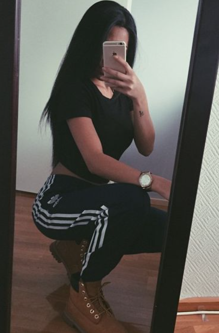 girl wearing adidas pants