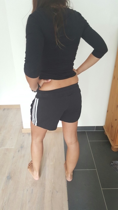 Girl in black/white Adidas shorts