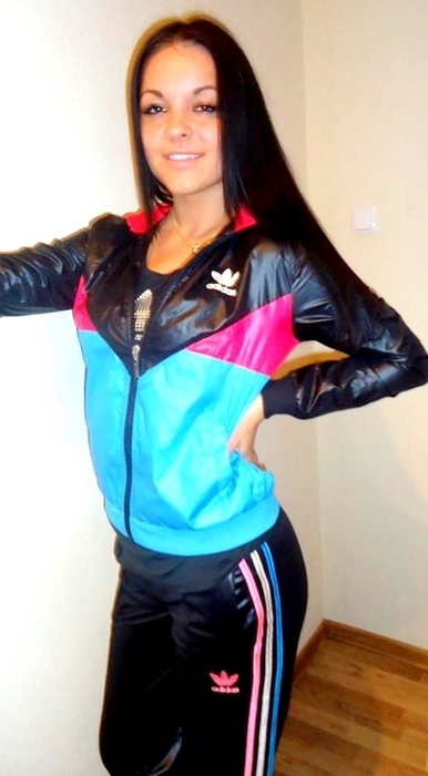 Girl in shiny adidas clothes