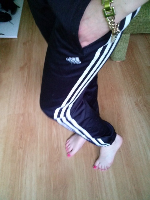 Girl with black/white adidas pants