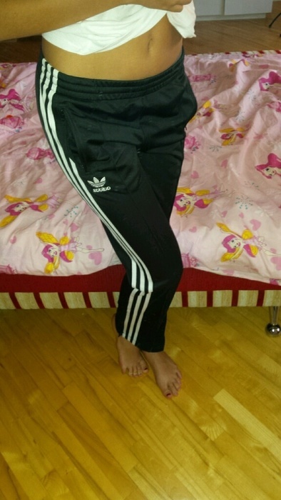 Girl with black/white adidas pants