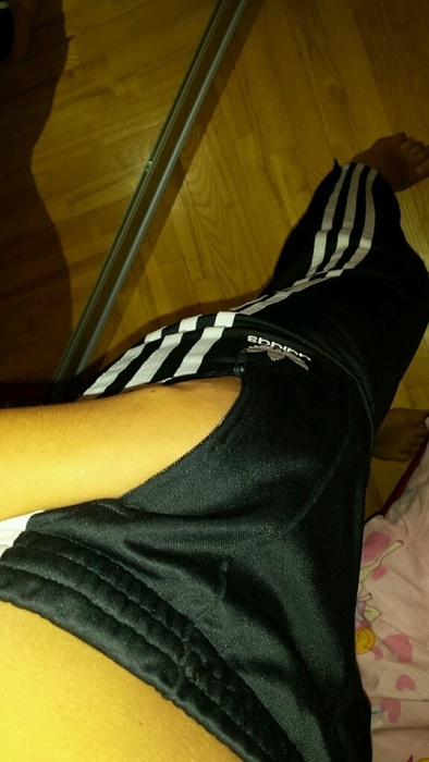 Girl with black/white adidas pants