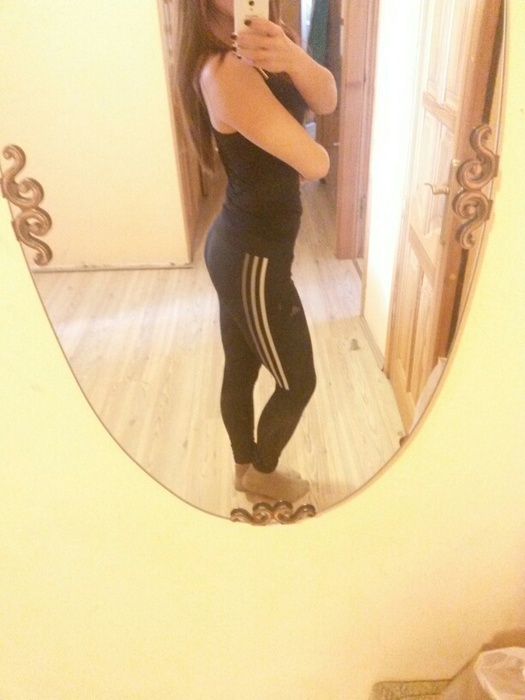 Girl with black/white adidas pants