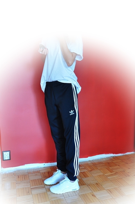 Girl with black/white adidas pants