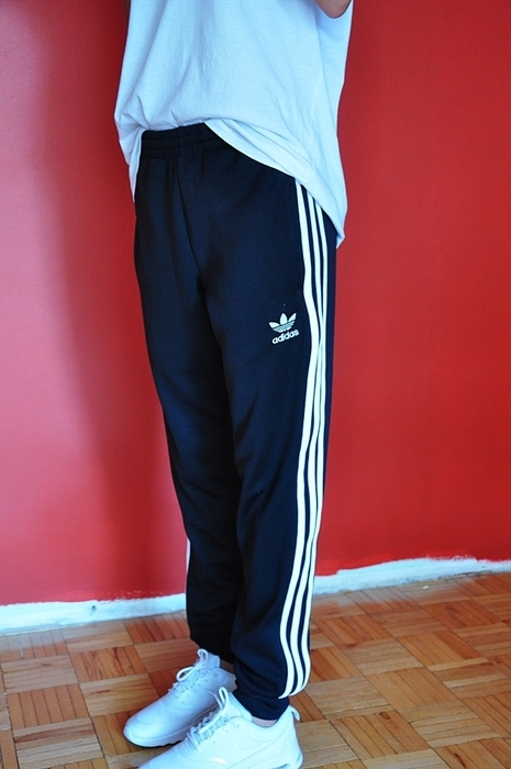 Girl with black/white adidas pants