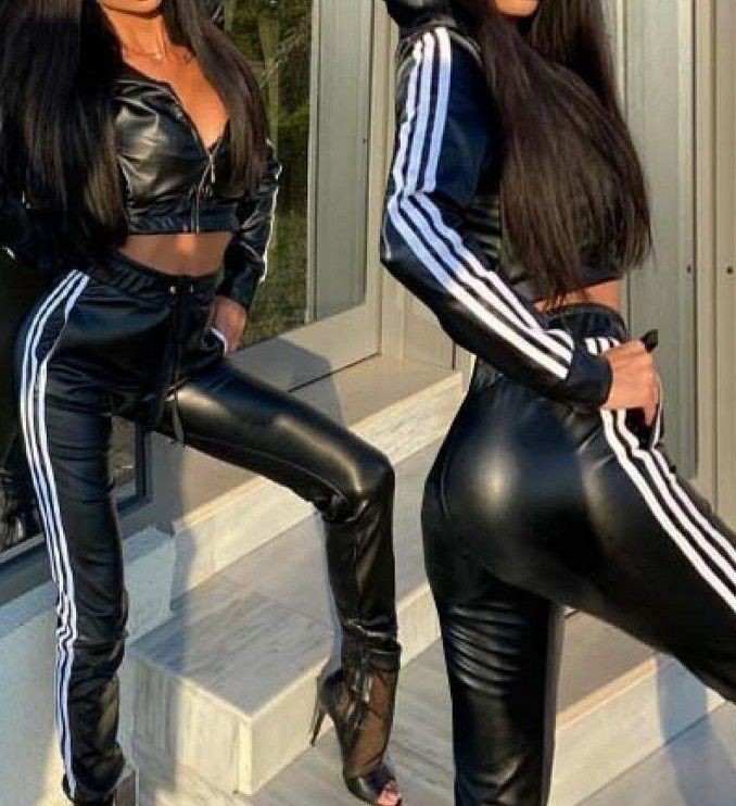 Shiny girl showing her adidas outfit